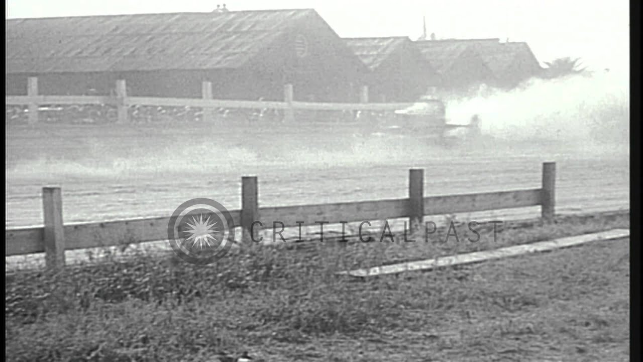 American race car driver Willard Prentiss crashes his car while