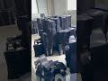 It's time for work. A thousand sets of black fishing suits are being produced