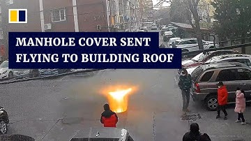 Manhole cover sent flying to building roof after boy sets off firecracker