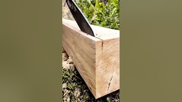 Chainsaw cuts log to clean plank - Why Work Hard When Machines and tools Work Smart?