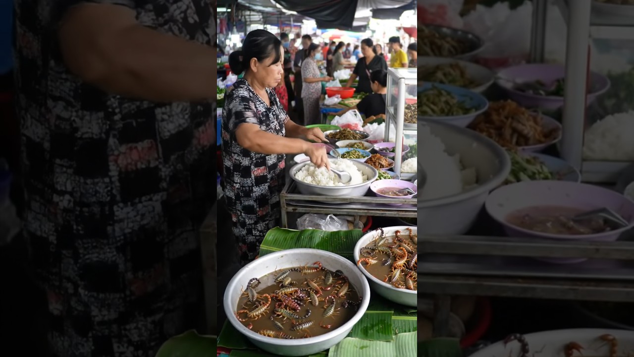 Middle-Aged Asian Woman Selling Rice and Scorpion Soup in Crowded Traditional Market.