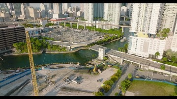 Bascule bridge over river in city. Opening of bridge for yacht passage. Tilt up reveal high rise