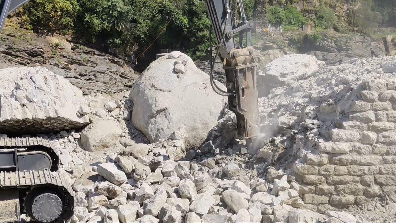 Rock breaker VS Hyundai Excavator working on Bridge Foundation in india 