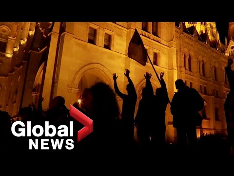 Thousands of hungarian protesters block budapest bridge in support of teachers