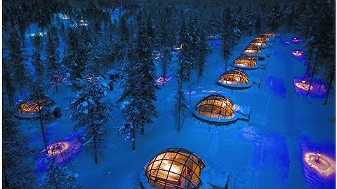 See the northern lights from a glass igloo in the middle of the finnish wilderness