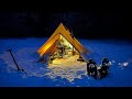 Snowstorm camping alone in hot tent  michigan backcountry