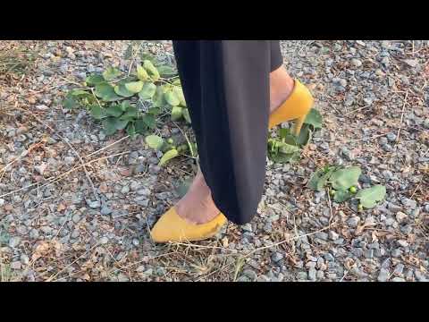 Sadaf crushing fields grass with her high heel
