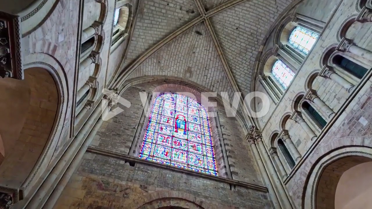 Stained glass windows interior and vaulted ceiling of Saint Julian Gothic Cathedral, Le Mans in Fran