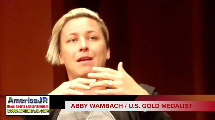 Abby Wambach talks iconic kiss with wife Sarah Huf...