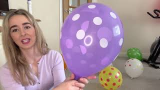 Blowing up my new polka dot themed balloons