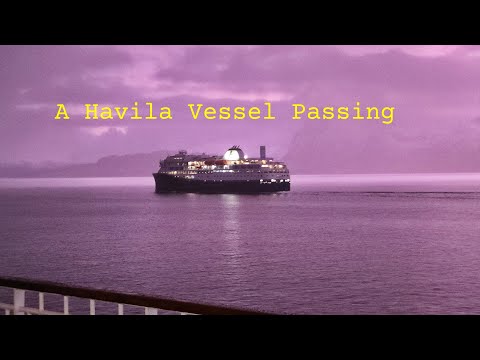 Havila vessel passing the MS Nordkapp in the Norwegian Sea