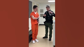 Handcuff with black box and belly chains