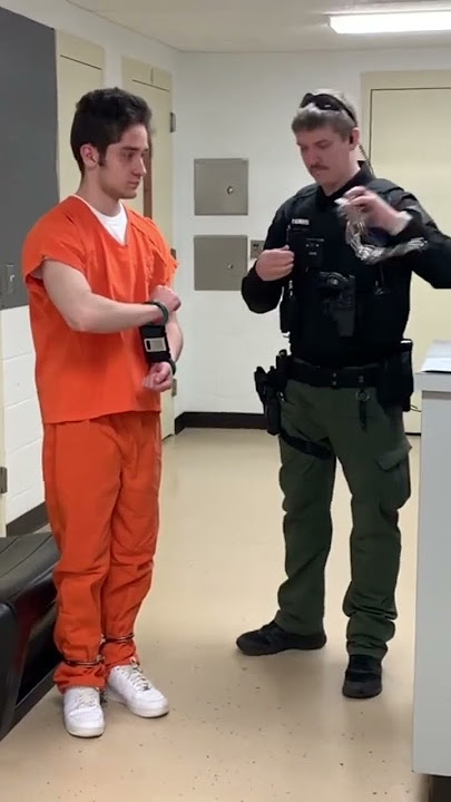 Handcuff with black box and belly chains