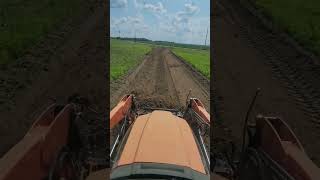 RK55 tractor pushing dirt