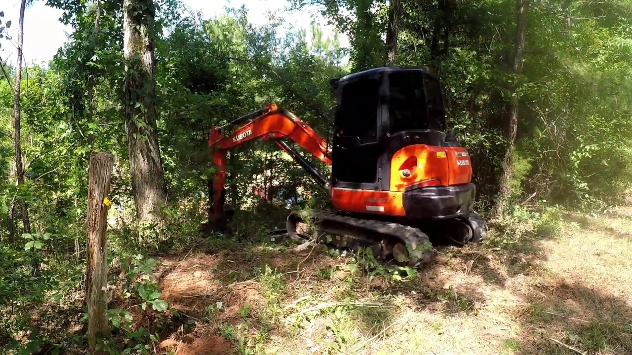 Clearing a right of way for utilities (power line) 285'. (kubota kx57