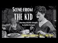 Scene from, The Kid (starring Charlie Chaplin and Jackie Coogan)