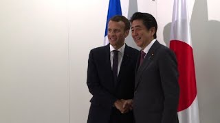 Emmanuel Macron meets Shinzo Abe in Saint-Petersburg