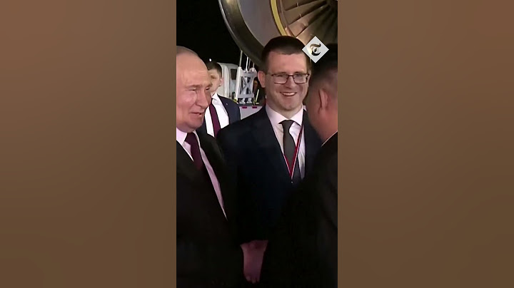 Vladimir Putin embraces Kim Jong-un as he lands in North Korea