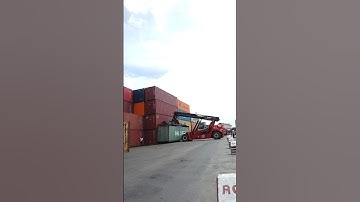 Kalmar Reach stacker with a tilting spreader for container handling