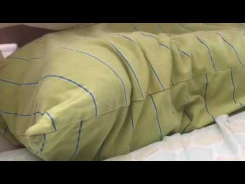 The cat in a pillowcase routine.