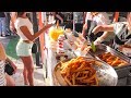 Cooking and Eating Sweet Churros in Kiev. Street Food in Ukraine