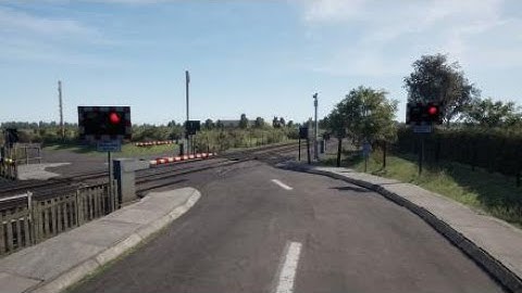 Class 375 passing a level crossing in TSW 2
