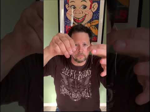 Comedian, magician Andy Gross performs a torn and restored string illusion!