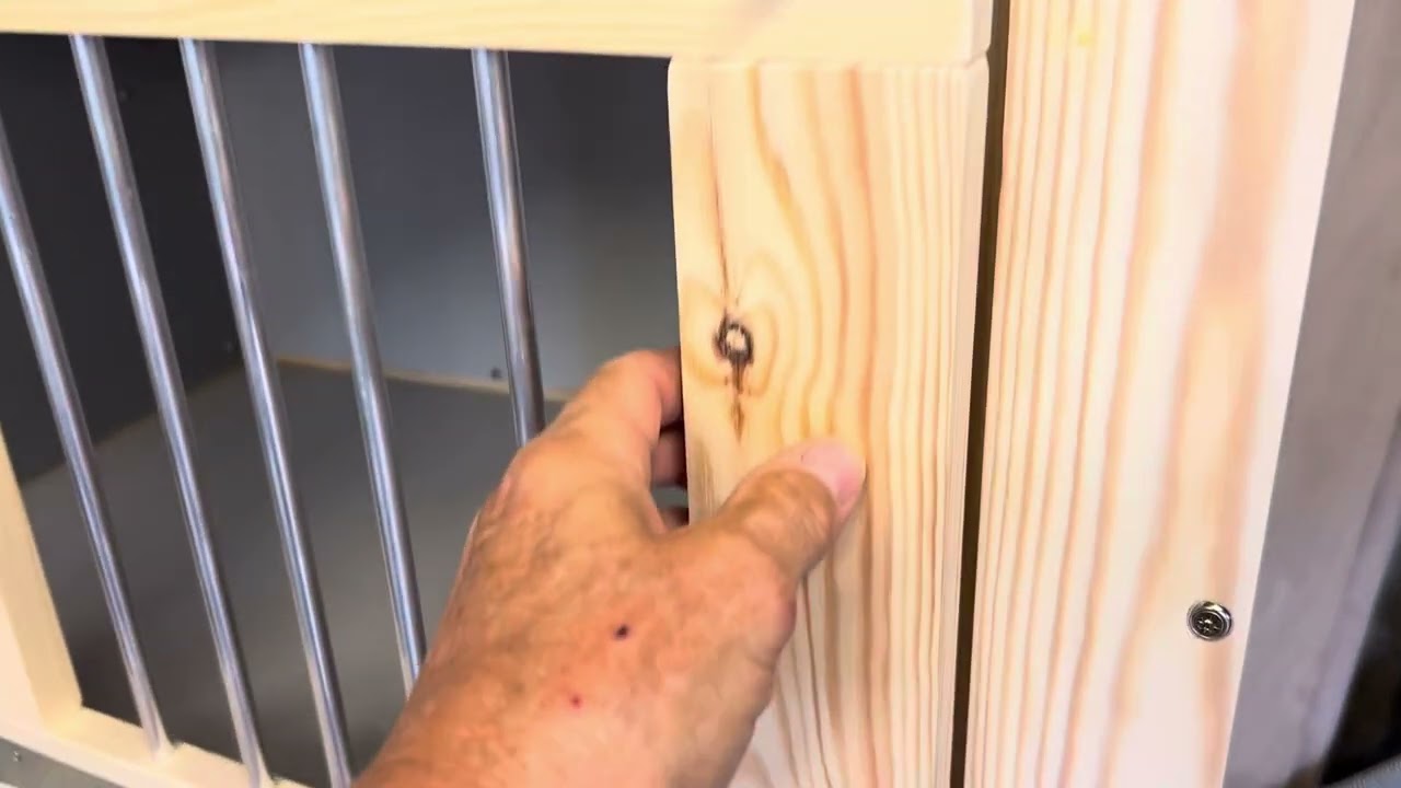 Indoor dog crate/ kennel with a side cabinet.