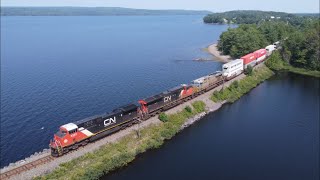 Awesome 4K Aerial View! Ac44C6M 3333 Leads a Long Stack Train CN 120 w/DPU pass Grand Lake, NS