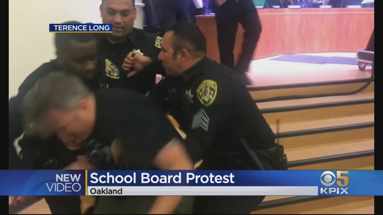 Six Protesters Arrested After Climbing Barrier At Oakland School Board Meeting