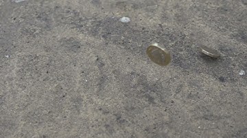 Slow motion of coins falling and bouncing CoinC0023 1