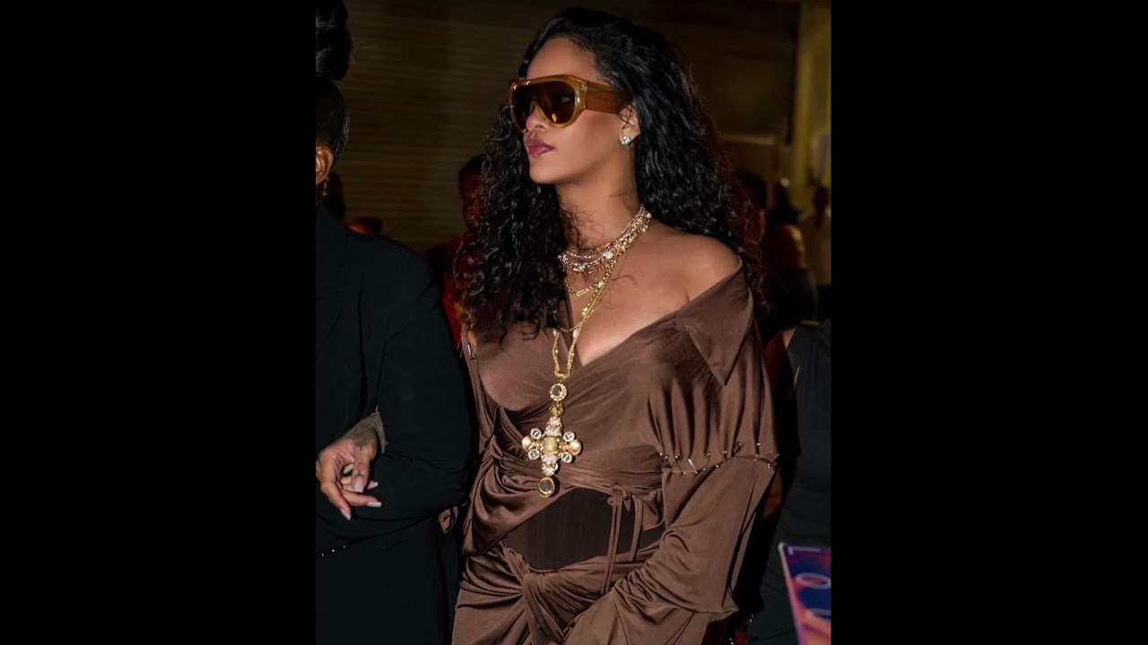 rihanna brown silk dress Racy display: The leggy lady was daring with her long legs on show in the short evening nu