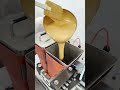 Nicolas making a Gold Almond Easter egg with Pomati spinning arms, tempering machine and One Shot.