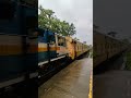 High speed train crossing at Cherukara station in rain