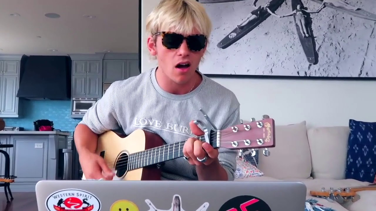 Ross singing and playing guitar and Rocky playing guitar in the R5TV writting hurts good