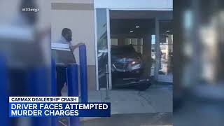 Driver faces attempted murder charges after crashing through Carmax dealership