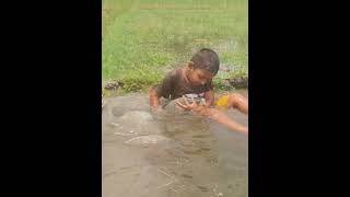 Cute Little Boy Fishing By Hand