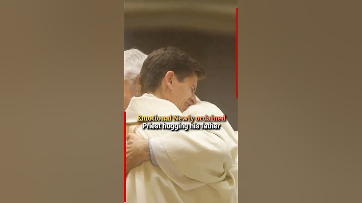 Emotional moment when a newly ordained priest embraces his father in a heartfelt hug #priest #father