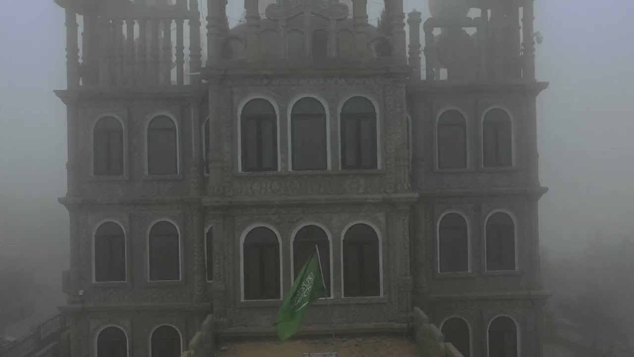 Aerial view of Al Meger tourist village in the fog, Asir province, Al Namas, Saudi Arabia