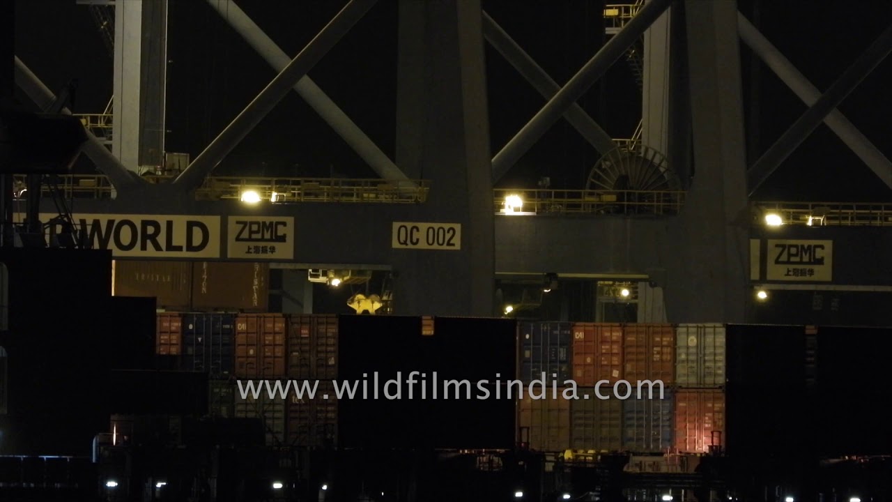 nepal flag Loading cargo at night: Cargo container ship at Kochi harbour
