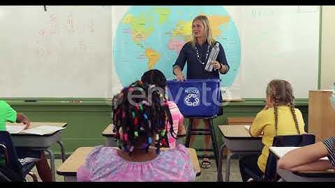 Teacher in front of class giving recycling lesson | Stock Footage - Envato elements