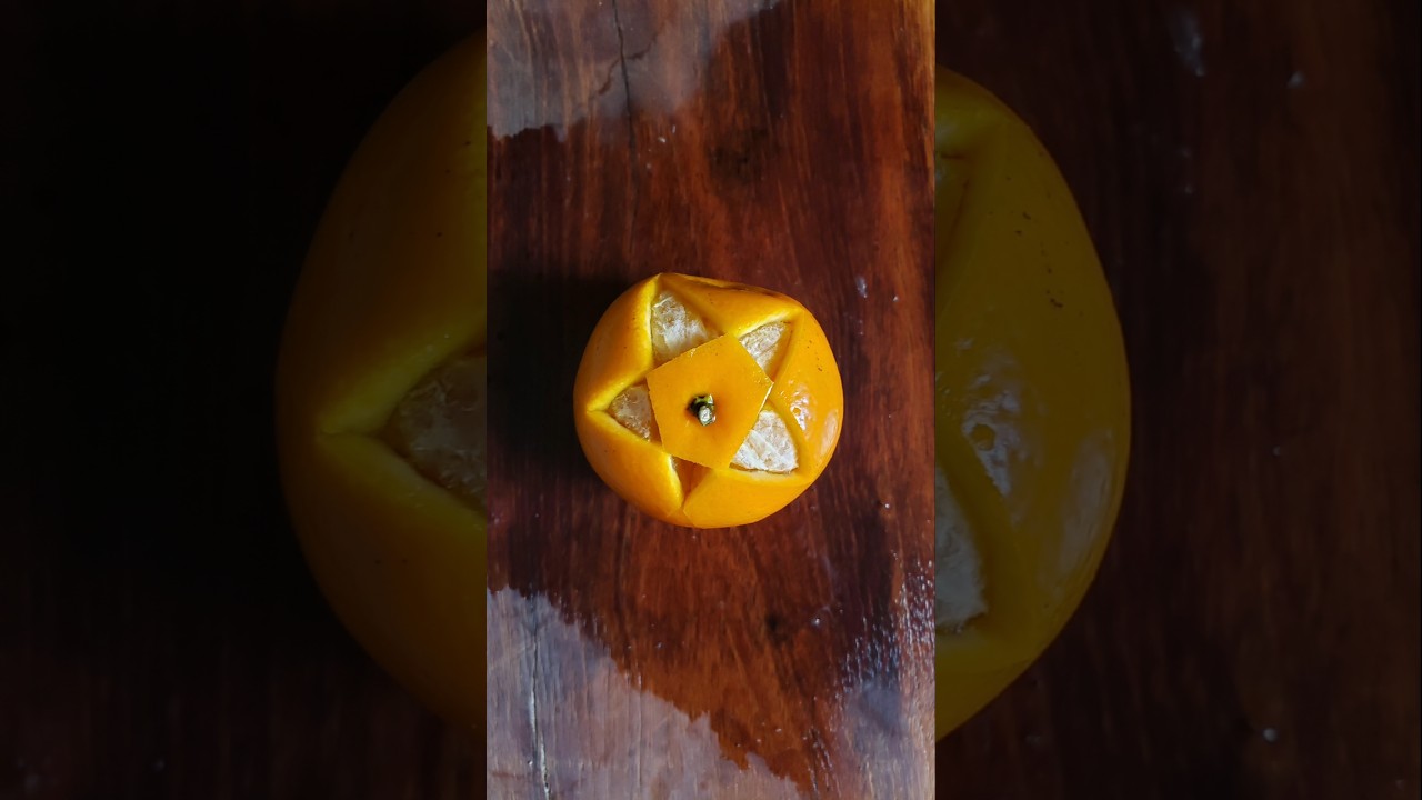 Star-Cut Orange on Wooden Table"