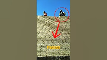 Bricklayer Using Mortar Finishing Trowel on Top Wall – High Speed Masonry Work.
