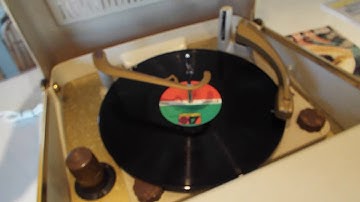 Motorola Calypso 4 speed BSR record player playing an LP record.