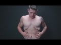 Man strips to show you loose skin after massive weight loss