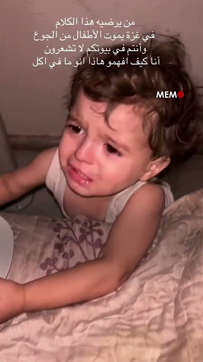 A hungry Gazan child walks up to his father, holding an empty plate