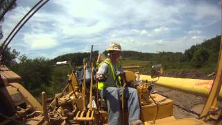 Running live CAT 583k sideboom in PA lowering in 7 joint section