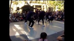Youthful dancers dancing in the street.