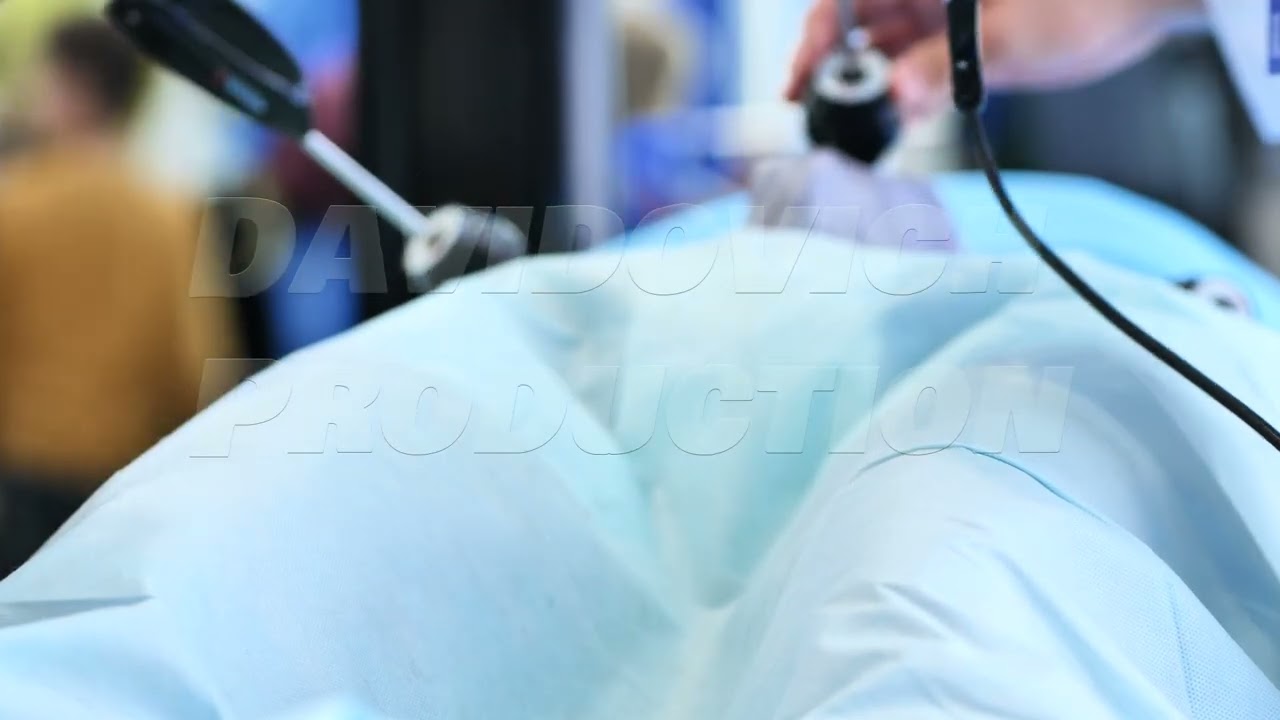 Surgeon performing endoscopic surgery on patient in operating room for medical procedure