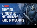 Met Police: Army on standby as officers hand in weapons